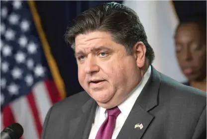  ?? SUN-TIMES FILE PHOTO ?? Gov. J.B. Pritzker (shown at a March news conference) announced Tuesday that the state will provide $25 million in grants so local government­s can accelerate public works projects to help revive local economies.