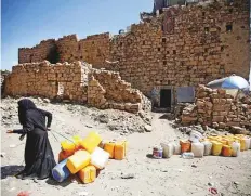  ?? Reuters ?? A woman displaced from Hodeida outside her family shelter in Sana’a. The government and Al Houthis have agreed to attend talks aimed at ending the three-year war.