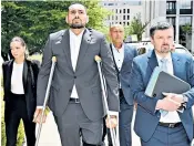  ?? ?? Nick Kyrgios arrives at court in Canberra on crutches yesterday
