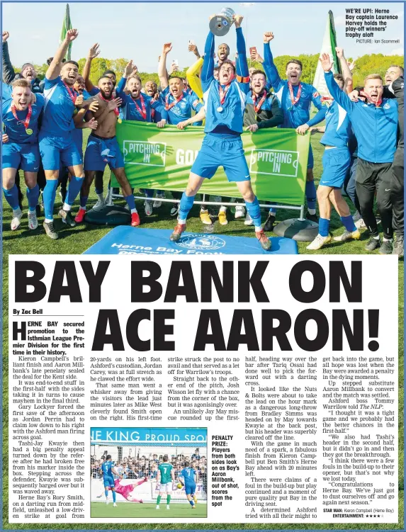  ?? PICTURE: Ian Scammell ?? PENALTY PRIZE: Players from both sides look on as Bay’s Aaron Millbank, out of shot, scores from the spot
WE’RE UP!: Herne Bay captain Laurence Harvey holds the play-off winners’ trophy aloft