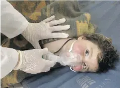  ?? IDLIB MEDIA CENTER VIA THE ASSOCIATED PRESS ?? A child is treated at a makeshift hospital following a suspected chemical attack in the Syrian town of Khan Sheikhoun on Tuesday. At least 11 children were killed.