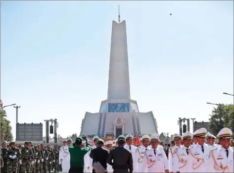  ?? ?? Members of the armed forces assemble at the Win-Win Monument to mark the 25th anniversar­y of the end of civil war, on December 29.