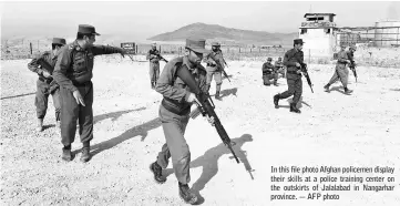  ??  ?? In this file photo Afghan policemen display their skills at a police training center on the outskirts of Jalalabad in Nangarhar province. — AFP photo