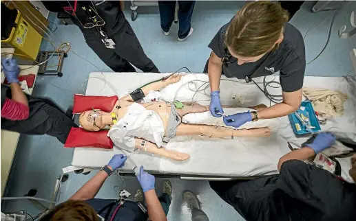  ?? LAWRENCE SMITH/ STUFF ?? Specialist A&amp;E nurses at Auckland’s Starship children’s hospital perform a simulated drill on an injured manikin as part of their training in preparatio­n for the real thing.
