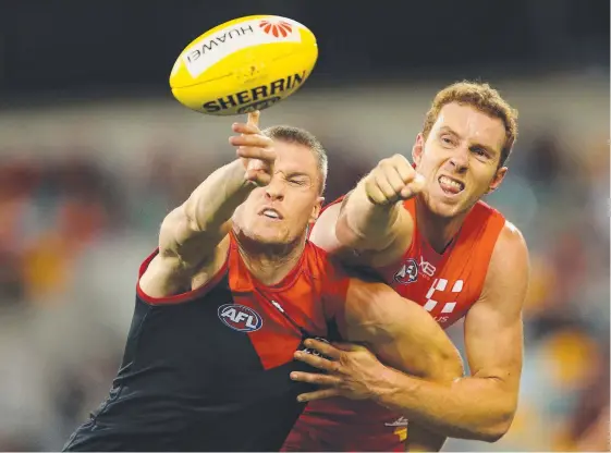  ?? Picture: GETTY IMAGES ?? Rory Thompson of the Suns, right, challenges the Demons’ Tom McDonald during the AFL Round 8 clash at The Gabba.