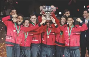  ?? ?? Canada’s team holds the trophy after winning the Davis Cup tennis tournament at the Martin Carpena sportshall, in Malaga, Spain, on Sunday. (AFP)