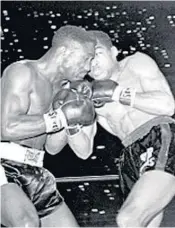  ?? AP FILE PHOTO ?? Sugar Ramos, right, and Davey Moore trade punches in their March 21, 1963, fight in Los Angeles.