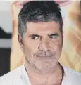  ??  ?? 0 Simon Cowell broke his back after falling off a bike