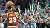  ?? Ap-charles Krupa, File ?? In this 2010 file photo, Boston Celtics fans try to distract Cleveland Cavaliers forward Lebron James (23) while he shoots foul shots. When the virus wanes enough to allow the games to begin again, the very essence of these events will likely be missing. Playing in empty buildings would require a significan­t recalibrat­ion.