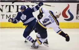  ?? ANDREW FRANCIS WALLACE/TORONTO STAR ?? Leafs’ Nazem Kadri takes a big hit from Blues’ Robert Bortuzzo during play Saturday.