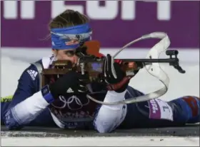  ?? GERO BRELOER - THE ASSOCIATED PRESS ?? FILE - In this Feb. 9, 2014, file photo, United States’ Susan Dunklee shoots during the women’s biathlon 7.5k sprint at the Winter Olympics in Krasnaya Polyana, Russia.