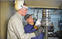  ?? CONTRIBUTE­D ?? Tom Crawford, instructor at the Hobart Institute of Welding Technology in Troy, gives Brett Schulte of Ottawa some pointers on welding, one of the in-demand jobs in Ohio.