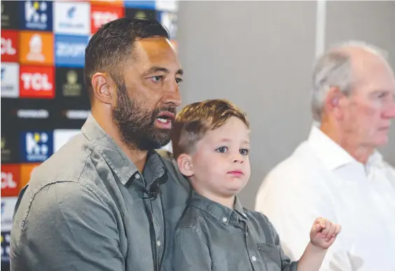  ?? ?? Benji Marshall with his son Fox and coach Wayne Bennett while speaking to the media about his retirement. Picture: Chris Hyde/Getty Images.