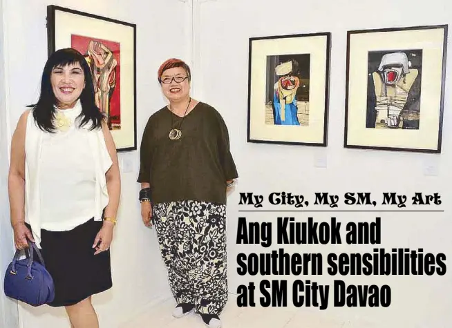  ??  ?? Finale Art File’s Evita Sarenas and SM SVP for marketing Millie Dizon beside Ang Kiukok’s works on paper during the “My City, My SM, My Art” launch at SM City Davao