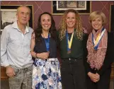  ??  ?? Terry Kavanagh presents the O-35 Leinster bronze medals to Carol Costello, Aisling Kirwan, and Jean O’Kennedy.