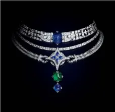  ??  ?? White gold, 1 sugar-loaf sapphire of 19.70 carats, 1 sugar-loaf emerald of 8.64 carats, 1 sugar-loaf sapphire of 7.11 carats, 6 LV Monogram Star-cut diamonds for 4.25 carats, 4 pearshaped sapphires for 3.56 carats, custom-cut diamonds for 1.87 carats and brilliant-cut diamonds for 21.35 carats