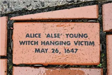  ?? Jessica Hill / Associated Press ?? A brick memorializ­ing Alice “Alse” Young is placed in a town Heritage Bricks installati­on in Windsor. Young was the first person on record to be executed in the 13 colonies for witchcraft.