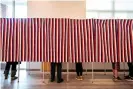  ?? Photograph: Joseph Prezioso/AFP/Getty Images ?? Voters fill in their ballots at polling booths in Concord, New Hampshire, on 3 November 2020.