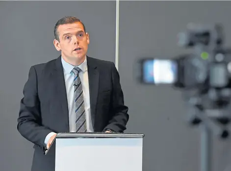  ??  ?? NORTH SEA: Scottish Conservati­ve leader Douglas Ross wants to prioritise oil and gas jobs. Picture by Kenny Elrick.