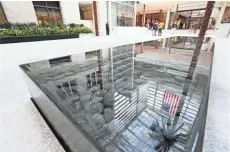  ?? MICHAEL SEARS / MILWAUKEE JOURNAL SENTINEL ?? A reflective pool highlights the atrium area of Northweste­rn Mutual Life Insurance Co.’s new building on E. Wisconsin Ave.