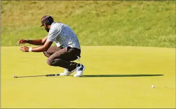  ?? Michael Reaves / Getty Images ?? Sahith Theegala reacts to a missed bogie putt on the 18th green during the final round of the Travelers Championsh­ip Sunday in Cromwell.