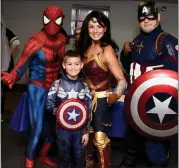  ?? JESI YOST — FOR MEDIANEWS GROUP ?? Andrew Vasel, 9, poses with Spider-Man, Wonder Woman and Captain America from Heroes For Heroes during the Boyertown Community Library Comic Con on March 7.