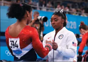  ?? LAURENCE GRIFFITHS/GETTY IMAGES ?? Simone Biles talks with Jordan Chiles of Team USA during the Women's Team Final on day four of the Tokyo 2020 Olympic Games at Ariake Gymnastics Centre on Tuesday in Tokyo, Japan.