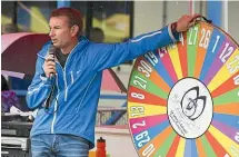  ??  ?? Ross Frater mans the chocolate wheel.