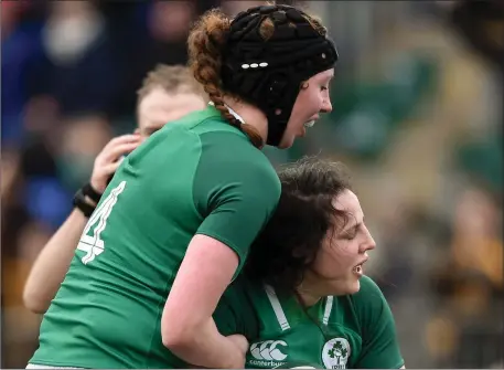  ??  ?? Paula Fitzpatric­k of Ireland is congratula­ted by team mate Aoife McDermott after scoring her side’s second try in Donnybrook.