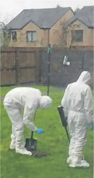  ??  ?? Forensics experts comb an area of garden on Benvie Road.