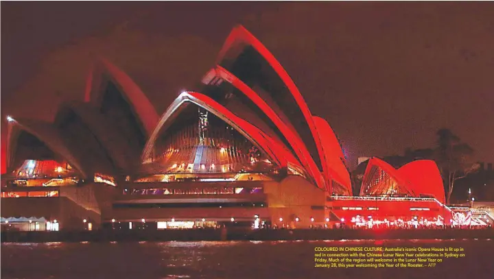  ?? COLOURED IN CHINESE CULTURE: Australia’s iconic Opera House is lit up in red in connection with the Chinese Lunar New Year celebratio­ns in Sydney on Friday. Much of the region will welcome in the Lunar New Year on January 28, this year welcoming the Year  ?? — AFP
A one-yearold cat Pooh playing with a toy with new bionic back paws. Two Bulgarian cats who lost their hind legs in accidents are being given new bionic paws in what vets say is the first such operation in Europe outside ground-breaking Britain....