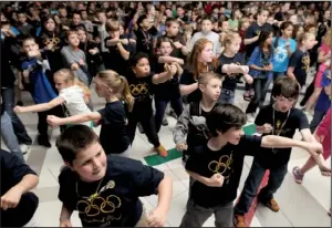  ?? NWA Media/ANTHONY REYES ?? Shaw Elementary School students dance Friday during a celebratio­n at the school in Springdale. The celebratio­n was intended to help fire up the students as they prepare to take the Benchmark Exams this week.