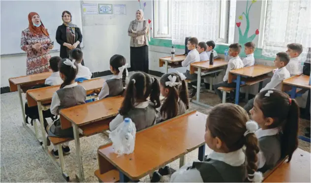  ?? Agence France-presse ?? ±
Pupils attend the first day of the new academic year in Arbil on Tuesday.