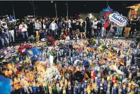  ?? Marcus Yam Los Angeles Times ?? A MEMORIAL for Nipsey Hussle at his L.A. store. Members of the Eritrean diaspora held vigils from Portland to Washington, D.C.