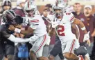  ?? KYLE ROBERTSON/COLUMBUS DISPATCH ?? Ohio State receiver Chris Olave caught four passes for 117 yards and two touchdowns in a win against Minnesota on Thursday night.