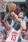  ?? DAVE EINSEL/ AP ?? TheWarrior­s' Andrew Bogut blocks a shot by the Rockets' James Harden ( 13).