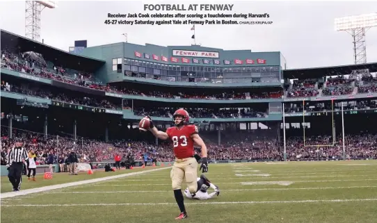  ?? CHARLES KRUPA/AP ?? Receiver Jack Cook celebrates after scoring a touchdown during Harvard’s 45-27 victory Saturday against Yale at Fenway Park in Boston.