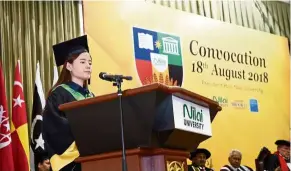  ??  ?? Tai delivering her valedictor­ian speech during the Nilai University convocatio­n ceremony.