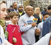  ?? REANN HUBER/REANN.HUBER@AJC.COM ?? Congressma­n John Lewis marches with students during the March For Our Lives event in Atlanta on Saturday.