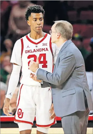  ?? [NATE BILLINGS/THE OKLAHOMAN] ?? Oklahoma coach Lon Kruger talks to Jamal Bieniemy during a Jan. 28 game against Baylor at Lloyd Noble Center.