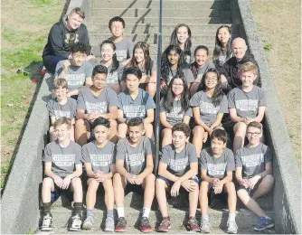  ?? NICK PROCAYLO ?? Greg Pears, third row, right, head of the physical education department at Sir Winston Churchill secondary, says the Sun Run school spirit prize helped pay for a year-end camping trip for students.