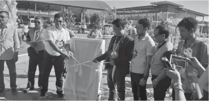  ?? (Photo courtesy of Elmer Sillo Zita) ?? Mayor Abraham Ibba (fourth from left) leads the inaugurati­on and opening in his municipali­ty of the Bataraza Town Center (BTC). The site is where the new Bataraza public market is located.