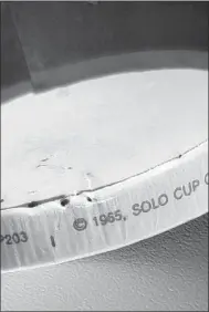  ?? Courtesy Photos ?? The cup with the date stamp of 1965 on the bottom inside rim.