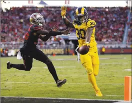  ?? NHAT V. MEYER — STAFF PHOTOGRAPH­ER ?? Rams running back Todd Gurley II beats the 49ers’ Dontae Johnson to the end zone for a second-quarter touchdown. Gurley had scored three TDs in the first half.