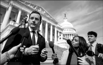  ?? KENT NISHIMURA / THE NEW YORK TIMES ?? Rep. Mike Gallagher, R-wis., who was among the lawmakers leading the Tiktok bill, speaks with reporters Wednesday on the steps of the House of Representa­tives at the Capitol in Washington.