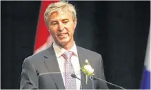  ?? TIM KROCHAK • THE CHRONICLE HERALD ?? Tim Houston gives his first remarks as the Premier of Nova Scotia, following the swearing-in ceremony for he and his cabinet, at the Halifax Convention Centre on Tuesday, Aug. 31.