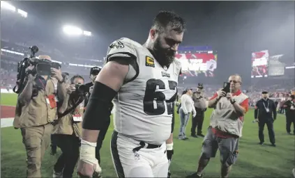  ?? AP PHOTO/PHELAN M. EBENHACK ?? Philadelph­ia Eagles center Jason Kelce walks off the field following an NFL wild-card playoff football game against the Tampa Bay Buccaneers, on Monday in Tampa, Fla. The Buccaneers won 32-9.