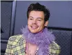  ?? PHOTO BY JORDAN STRAUSS/INVISION/AP, FILE ?? In this March 14, 2021, photo, Harry Styles poses in the press room at the 63rd annual Grammy Awards at the Los Angeles Convention Center.