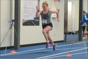  ?? NEWS PHOTO RYAN MCCRACKEN ?? Seventeen-year-old Jane Canadine sprints through a motion sensor at RBC Training Ground on Saturday at the Family Leisure Centre.