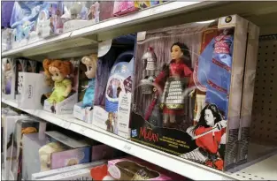  ?? CHRIS PIZZELLO — THE ASSOCIATED PRESS FILE ?? A doll based on the upcoming Walt Disney Studios film “Mulan” in the toy section of a Target department storein Glendale, Calif. As supply chain bottleneck­s create shortages on many items, some charities are struggling to secure holiday gift wishes from kids in need. They’re reporting they can’t find enough items in stock, or are facing shipping delays both in receiving and distributi­ng the gifts. The founder of the organizati­on One Simple Wish says many gift requests for gaming consoles and electronic items submitted to the charity have been out of stock.